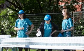Tamarack Ottawa Race Weekend volunteers serve up water on the course with the help of Aquahaulics
