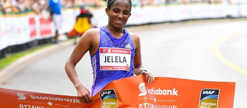 Koren Jelela crosses the 2016 Ottawa Marathon finish line